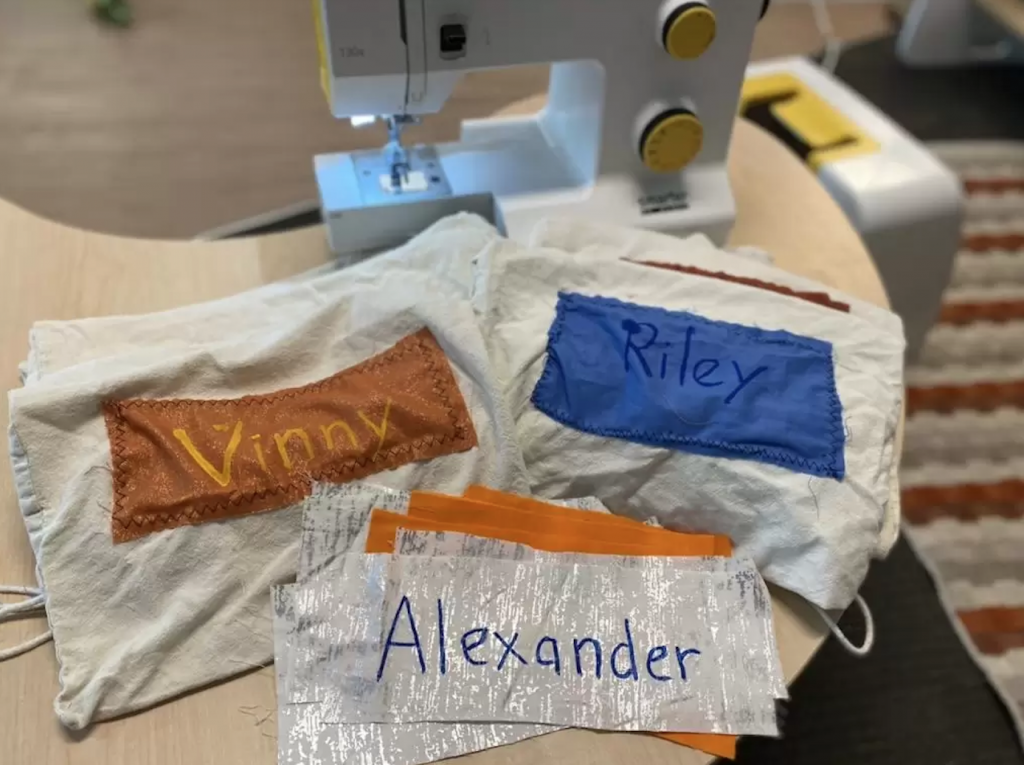 Name tags on bags at Explore & Develop Annandale