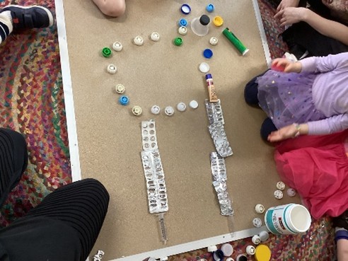 Preschool children sorting recycled materials